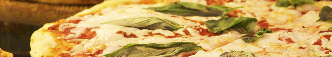 Eating Italian Pizza at Massimos Pizza and Pasta restaurant in Costa Mesa, CA.